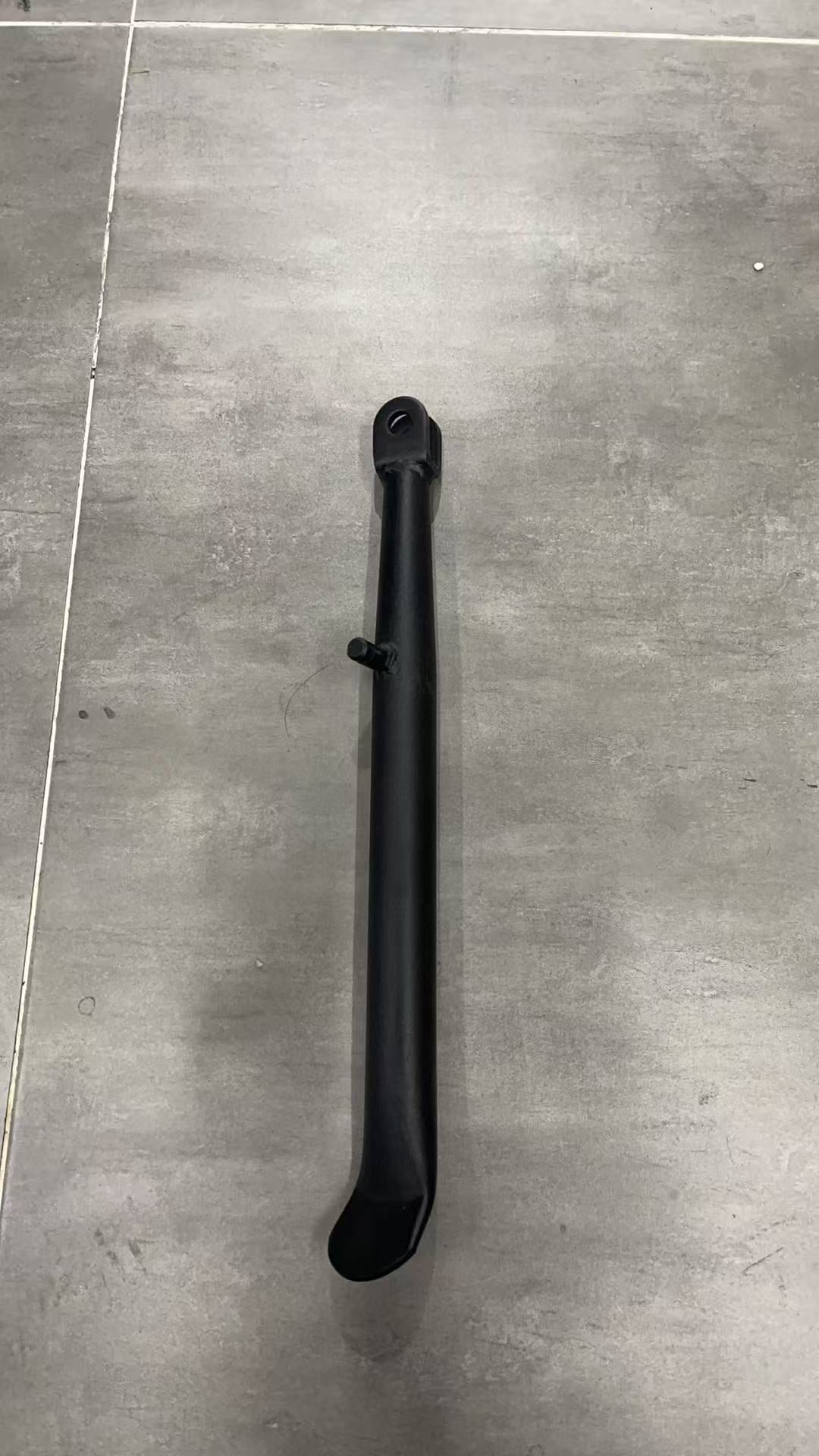 Black adjustable bike kickstand made of durable metal for stability and convenience.