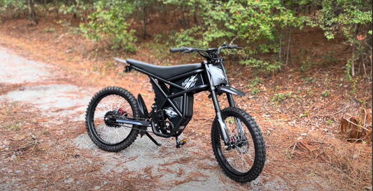 Riding Times GT73 electric bike on forest trail with off-road tires and rugged design