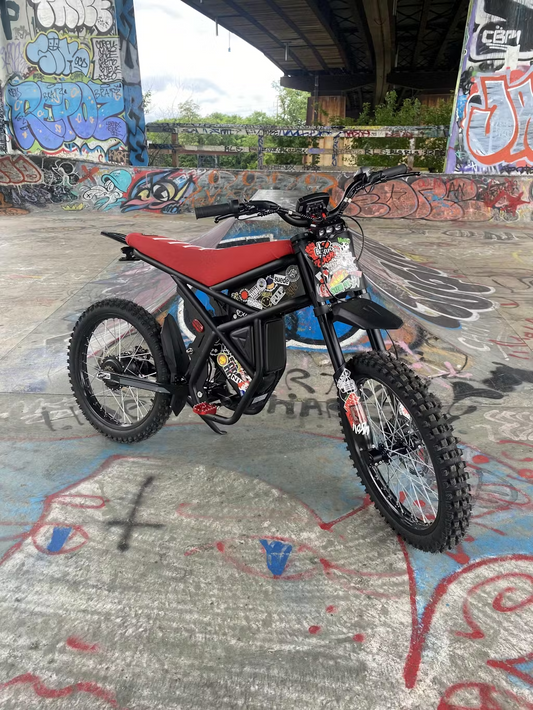 GT73 electric bike customized with stickers, parked in graffiti-covered urban skatepark, showcasing tips to increase the speed of your eBike.