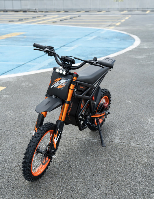 Riding Times GT54 electric dirt bike for women and teenagers with orange accents and off-road tires