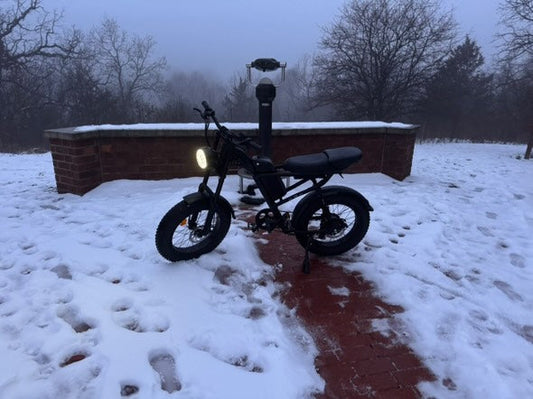 Riding Times Z8 eBike with headlight on parked on snowy trail in winter setting