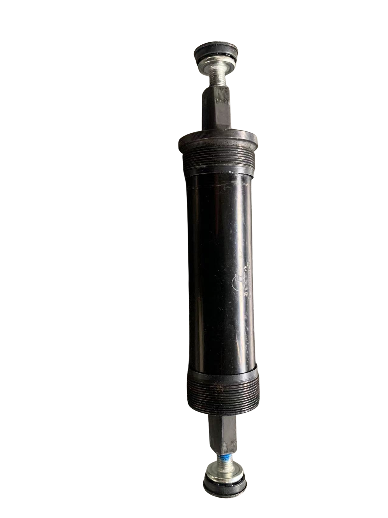 Black bicycle bottom bracket with sealed bearing system for smooth drivetrain rotation and efficient power transfer