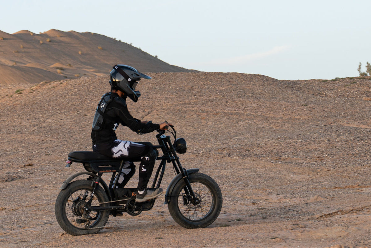 Person riding a GT33 in a desert landscape