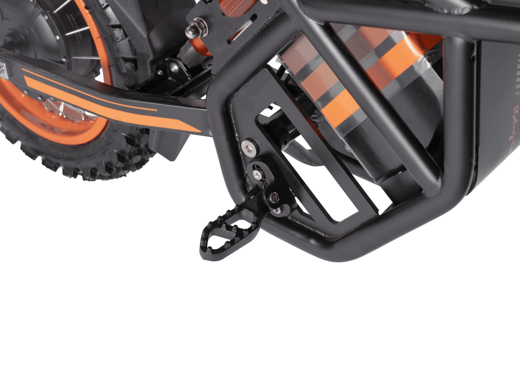 Close-up of GT54 electric mini motorbike frame and pedal with orange accents and sturdy black metal construction