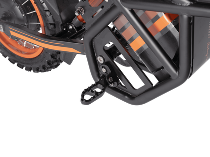 Close-up of GT54 electric mini motorbike frame and pedal with orange accents and sturdy black metal construction