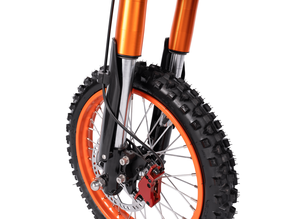 Close-up of GT54 electric mini motorbike front wheel with knobby tire and suspension forks.