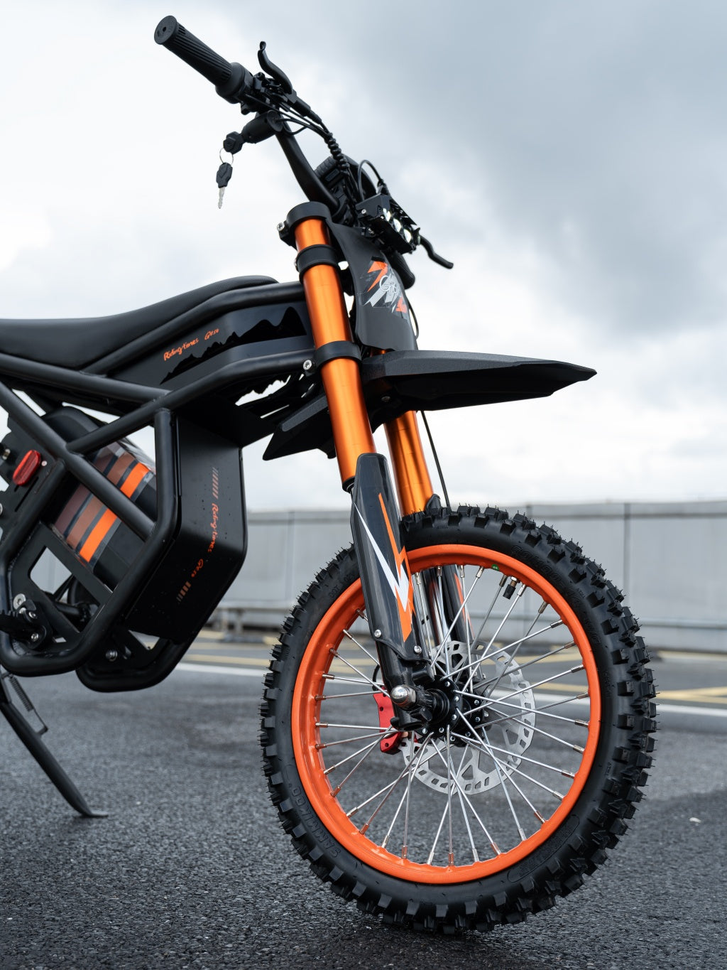 GT54 electric mini motorbike with orange suspension and knobby tires for kids and adults