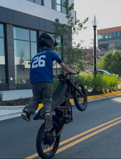 Person on a GT73 pro performing a stunt in an urban setting