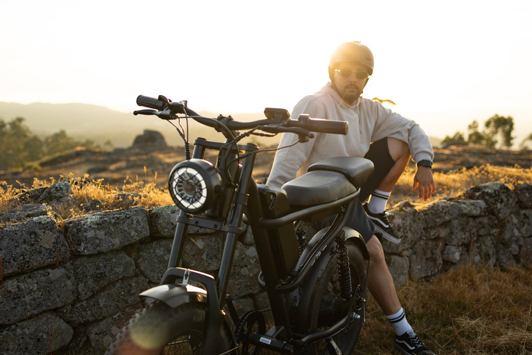 Person sitting on a stone wall with a Z8 in a scenic outdoor setting